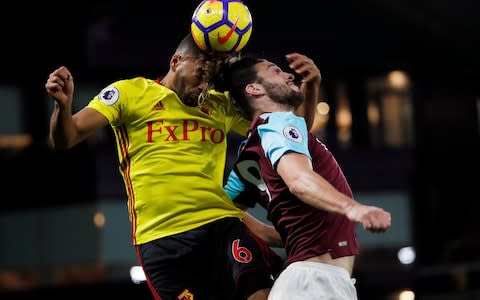 Watford's Adrian Mariappa in action with West Ham United's Andy Carroll - Credit: REUTERS