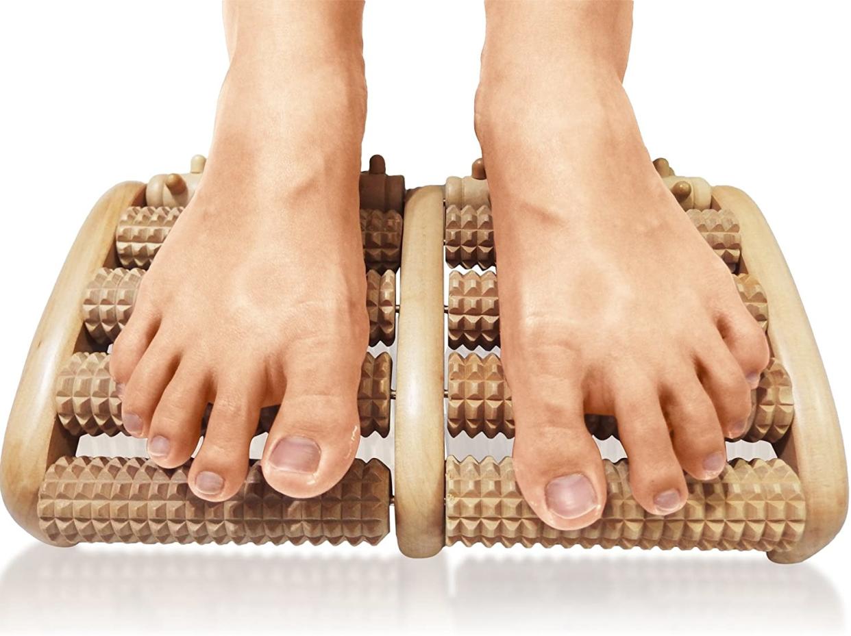 Feet on wooden massager