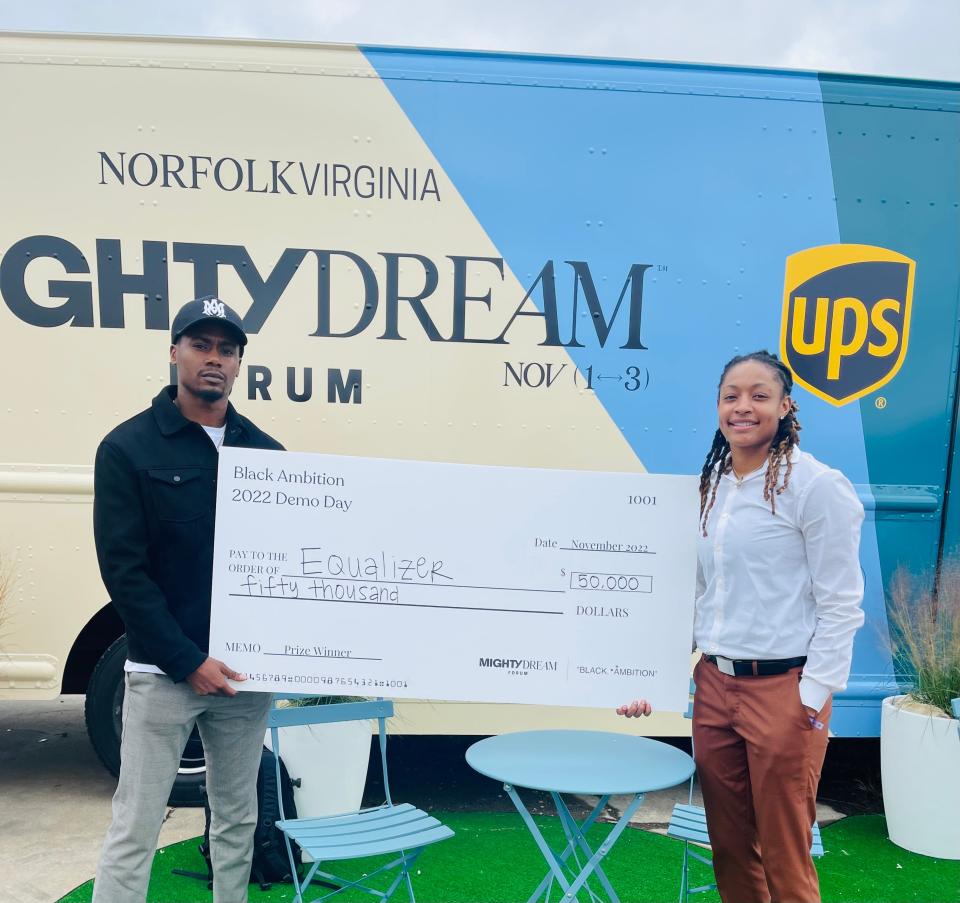 Armon'da Davis and Nicki Ekhomu pictured with $50,000 award at the Mighty Dream Forum.