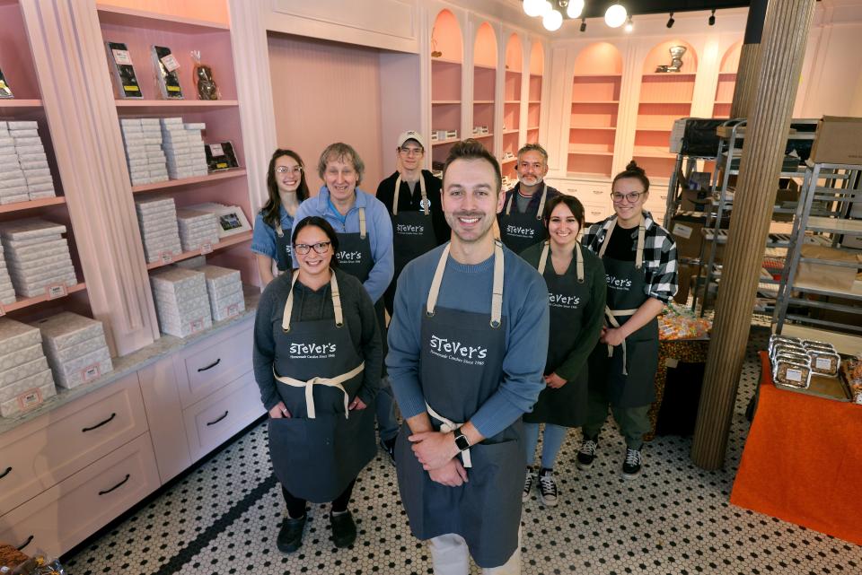 In front, John Vangellow, 27, new co-owner of Stever’s Candies, 623 Park Ave., with some of his employees in the recently remodeled store.
