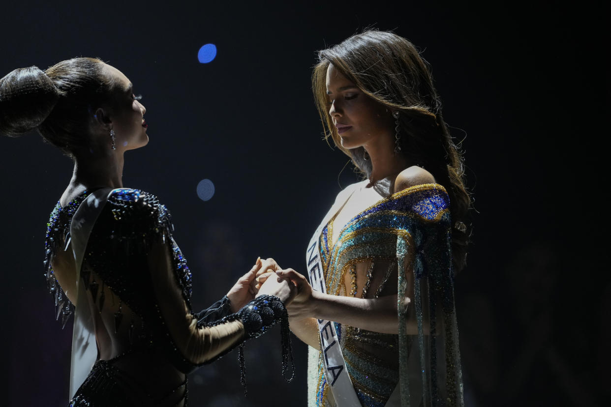Miss USA R' Bonney Gabriel, left, and Miss Venezuela Amanda Dudamel wait to hear which one will be crowned Miss Universe, which was Miss USA, during the final round of the 71st Miss Universe Beauty Pageant in New Orleans, Saturday, Jan. 14, 2023. (AP Photo/Gerald Herbert)