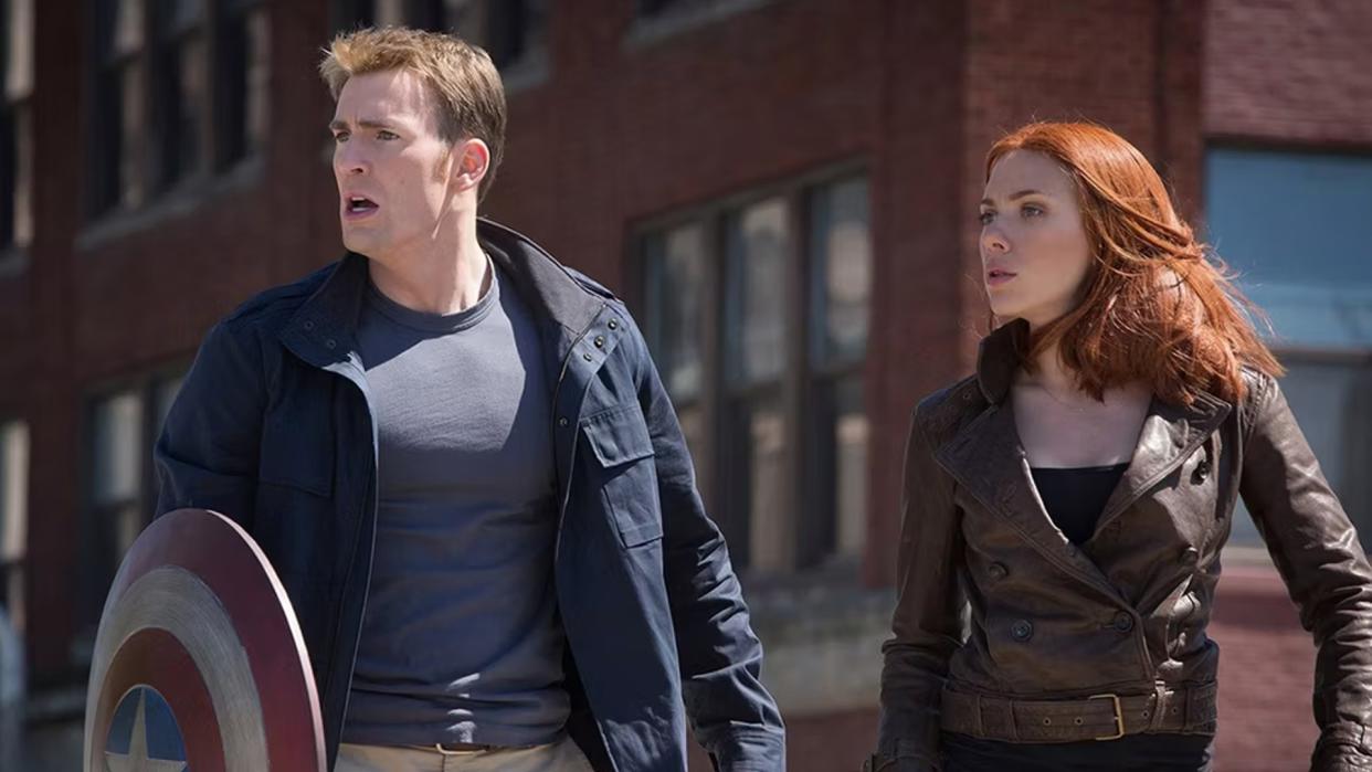 Chris Evans and Scarlett Johansson strike a hero pose in a still from Captain America: The Winter Soldier