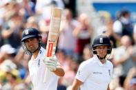 Britain Cricket - England v Pakistan - Second Test - Emirates Old Trafford - 22/7/16 England's Alastair Cook celebrates his half century as Joe Root looks on Action Images via Reuters / Jason Cairnduff Livepic