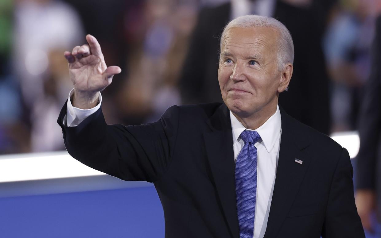 Biden gestures after addressing the audience during the opening night of the Democratic National Convention