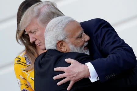 India's Prime Minister Narendra Modi hugs U.S. President Donald Trump as he departures the White House after a visit, in Washington, U.S., June 26, 2017. REUTERS/Carlos Barria