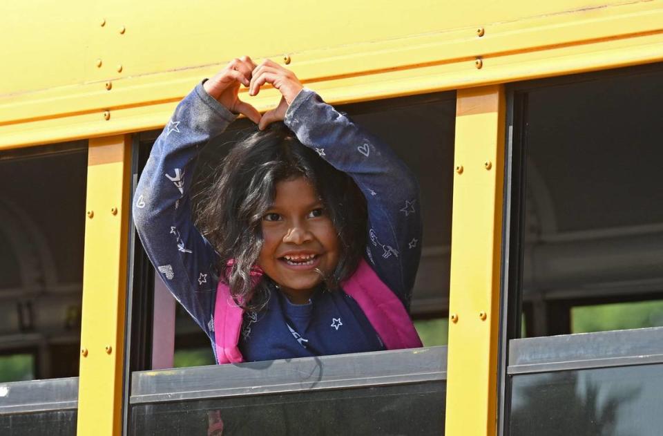 Sterling Elementary School kindergartner Nahslyn Orellana makes a heart to the staff of the school as she prepares to leave for summer break on Friday, June 9, 2023.