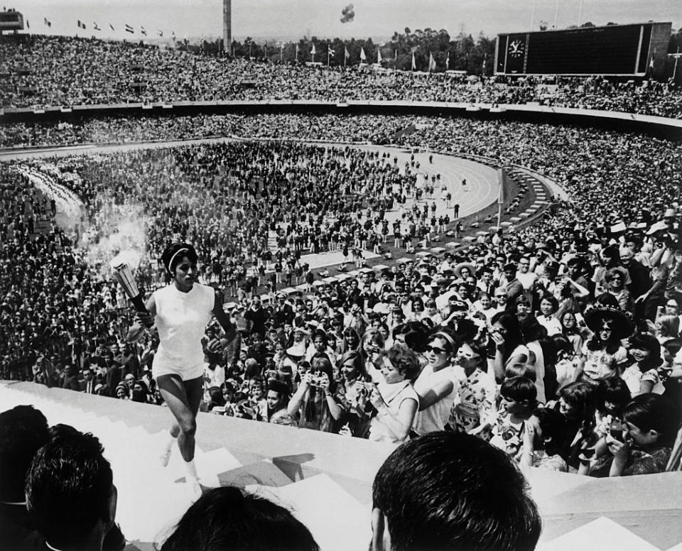 <p>Mexican hurdler Enriqueta Basilio gets the honor of being the first woman to light the Olympic flame. The opening ceremony was viewed by over 100,000 spectators (despite the fact that the stadium <a href="https://bryanpinkall.blogspot.com/2012/07/1968-summer-olympic-opening-ceremony.html" rel="nofollow noopener" target="_blank" data-ylk="slk:could only hold around 63,000;elm:context_link;itc:0;sec:content-canvas" class="link ">could only hold around 63,000</a>). </p>