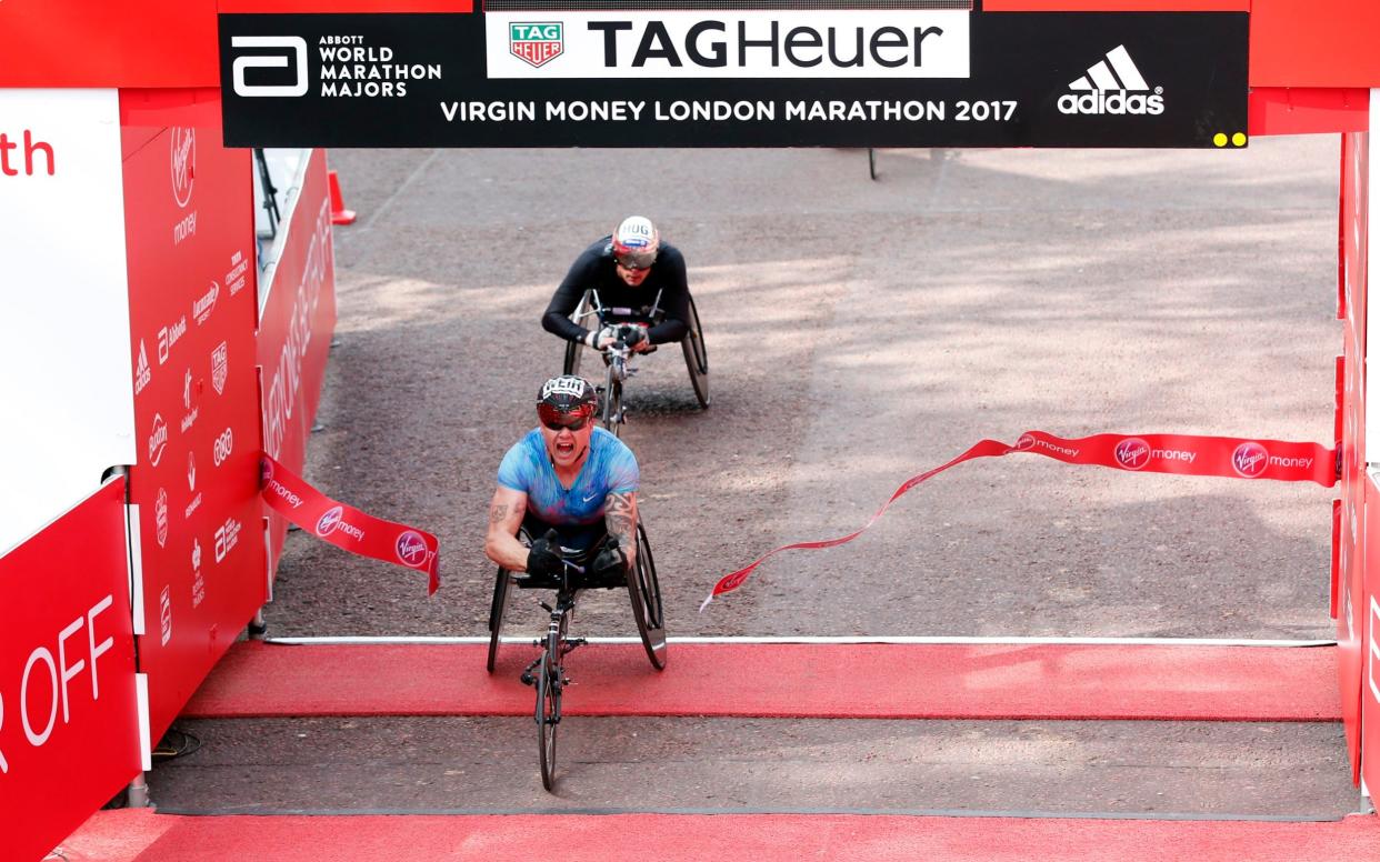 David Weir crosses the finish line in first place - REUTERS