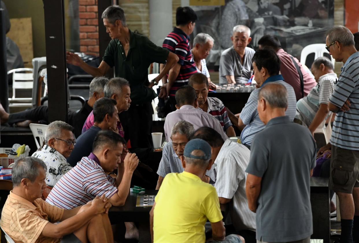 Elderly people play board games in Chinatown on 19 February, 2018. (AFP via Getty Images file photo)