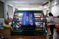 <p>A worker makes flags for U.S. President Donald Trump’s “Keep America Great!” 2020 re-election campaign at Jiahao flag factory in Fuyang, Anhui province, China July 24, 2018. (Photo: Aly Song/Reuters) </p>