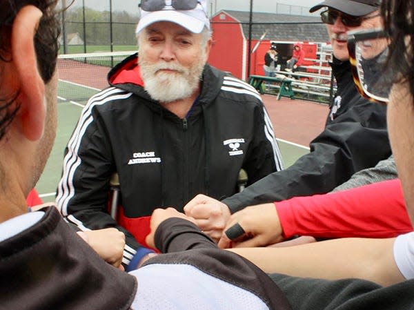 Honesdale boys tennis coach Keith Andrews huddles up with his players during Lackawanna League action this spring.