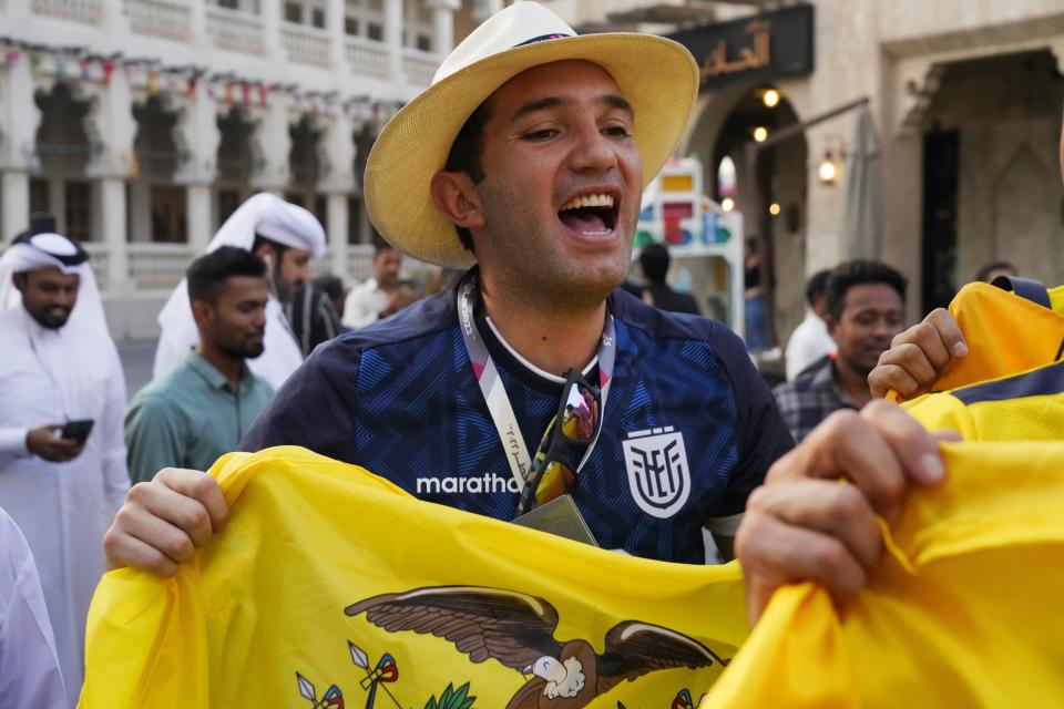Ecuador fan Pablo Zambrano of Quito, Ecuador, cheers in Doha, Qatar, Friday, Nov. 18, 2022. Fans poured into Qatar on Friday ahead of the Middle East's first World Cup as Doha ordered beers not to be poured out at stadiums during the tournament — a last-minute surprise largely welcomed by the country's conservative Muslims and shrugged off by giddy fans. (AP Photo/Jon Gambrell)
