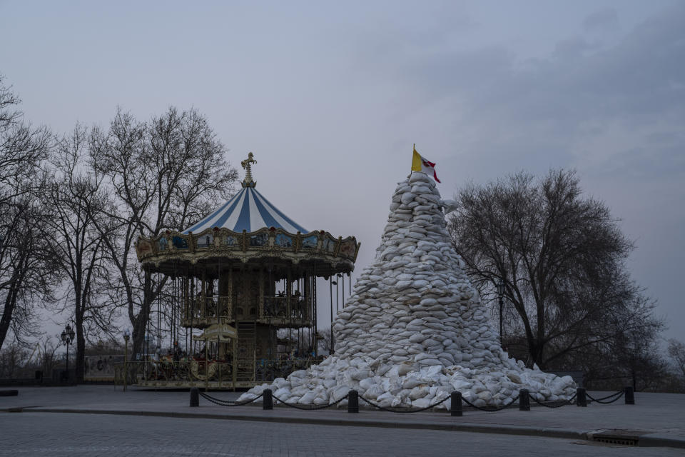 FILE - The monument of the Duke of Richelieu, is covered with sandbags next to a carousel, in Odesa, Ukraine, on March 24, 2022. The Black Sea port is mining its beaches and rushing to defend itself from a Mariupol-style fate. Some Western officials believe the city, which is dear to Ukrainians' hearts, could be next. (AP Photo/Petros Giannakouris, File)