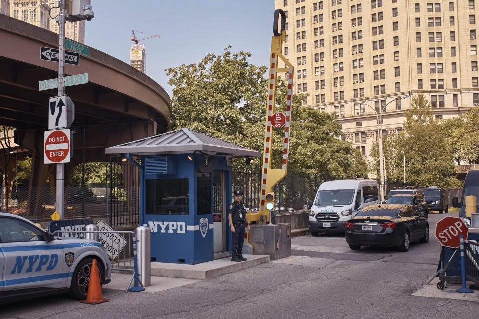 A police officer stands guard outside One Police Plaza NYPD Headquarters on Friday, Sept. 13, 2024, in New York. (AP Photo/Andres Kudacki)