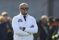 Minnesota head coach P.J. Fleck watches warm ups before an NCAA college football game against Iowa, Saturday, Nov. 16, 2019, in Iowa City, Iowa. (AP Photo/Matthew Putney)