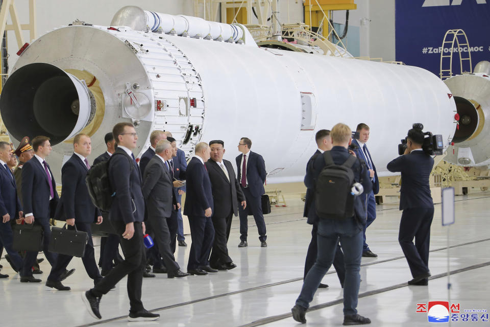 In this photo provided by the North Korean government, Russian President Vladimir Putin, center left, and North Korean leader Kim Jong Un, center, visit the Vostochny cosmodrome outside the city of Tsiolkovsky, about 200 kilometers (125 miles) from the city of Blagoveshchensk in the far eastern Amur region, Russia, Wednesday, Sept. 13, 2023. Independent journalists were not given access to cover the event depicted in this image distributed by the North Korean government. The content of this image is as provided and cannot be independently verified. Korean language watermark on image as provided by source reads: "KCNA" which is the abbreviation for Korean Central News Agency. (Korean Central News Agency/Korea News Service via AP)