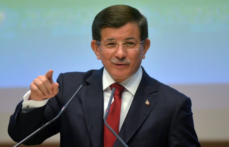 Turkish Prime Minister Ahmet Davutoglu addresses the 104th enlarged meeting of provincial chairmans of Justice and Development Party at party headquarters in Ankara on August 28, 2015