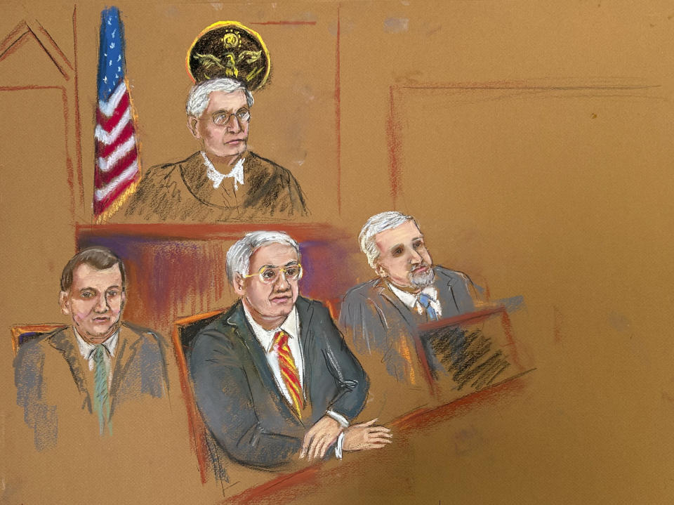 Wael Hana, left, Sen. Bob Menendez, center, and Fred Daibes, sit in Manhattan federal court with Judge Sidney H. Stein presiding during jury selection, Monday, May 13, 2024, in New York. Menendez, a Democrat, went on trial in Manhattan federal court Monday, accused of accepting bribes of gold and cash to use his influence to deliver favors that would help three New Jersey businessmen. (Candace E. Eaton via AP)