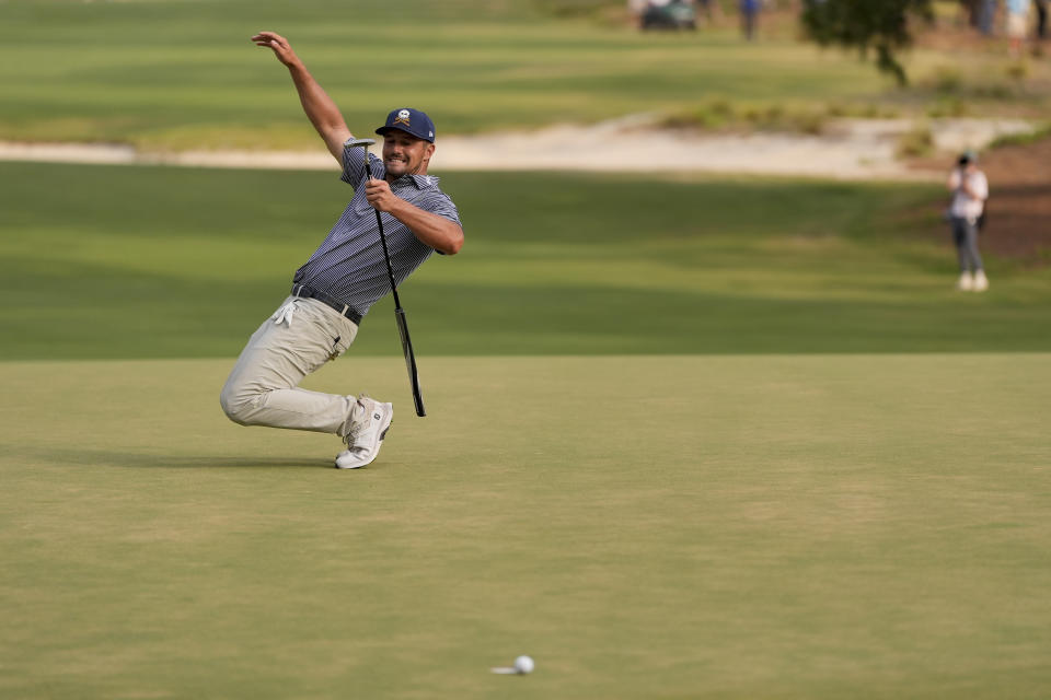 Bryson DeChambeau reacts after missing a putt on the 16th hole during the final round of the U.S. Open golf tournament Sunday, June 16, 2024, in Pinehurst, N.C. (AP Photo/George Walker IV)