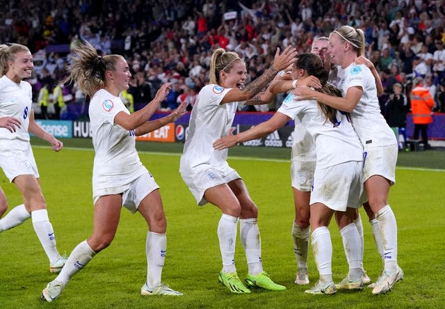 England players rush to congratulate Fran Kirby after making the score 4-0