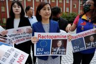 Legislators protest against letting American meat into Taiwan ahead of Czech Senate President Milos Vystrcil speech at the Legislative Yuan in Taipei