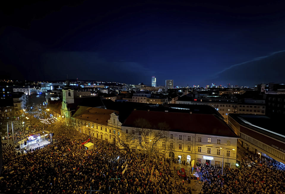 People gather to take part in a protest against a government plan to amend the penal code in Bratislava, on Thursday, Jan. 25, 2024. The changes proposed by the three-party coalition government include a proposal to abolish a special prosecutors' office, which handles serious crimes such as graft, organized crime and extremism. (Pavol Zachar/TASR via AP)