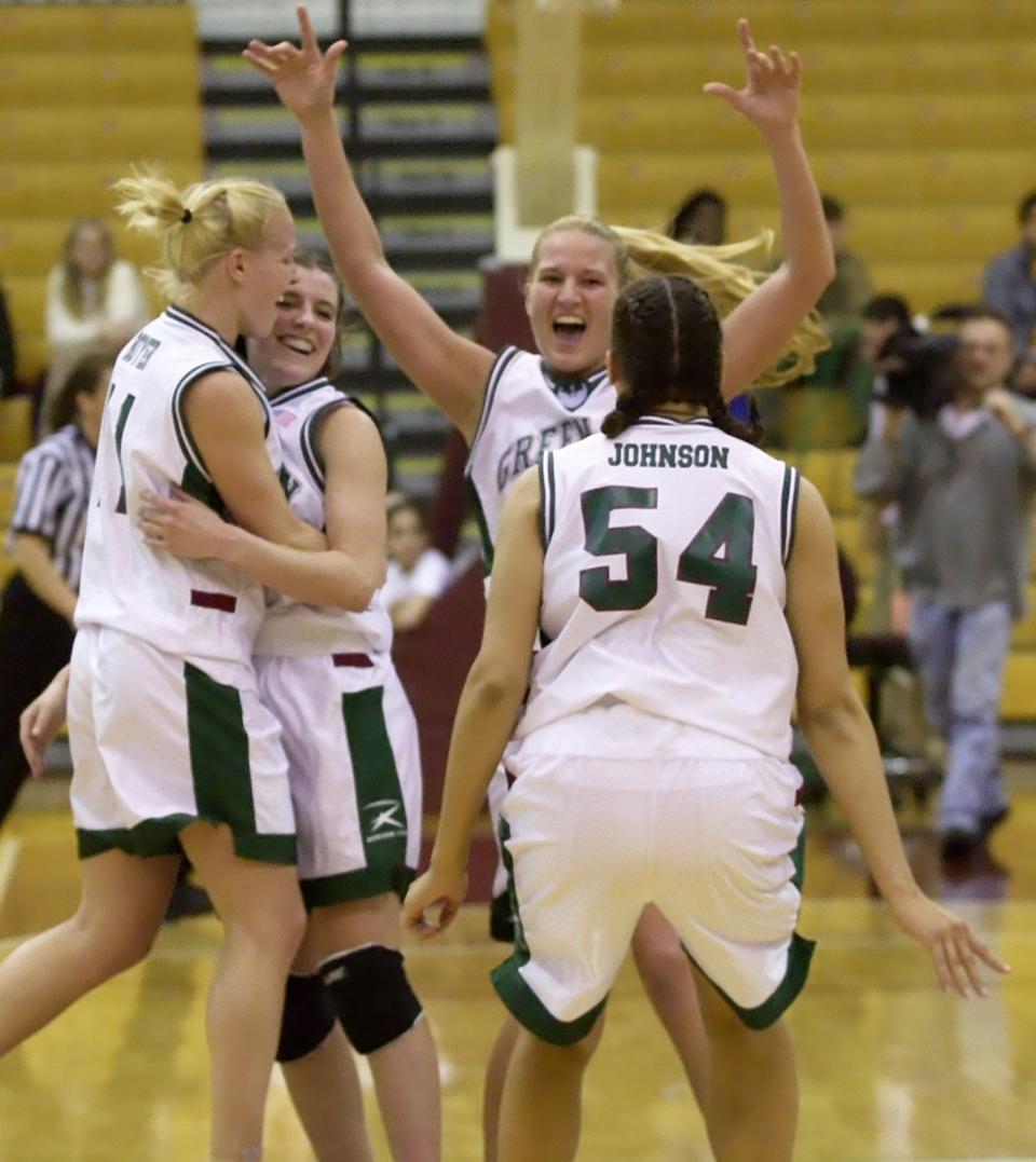 Wisconsin-Green Bay players, from left, Sara Boyer, Elizabeth Dudley, Mandy Stowe and Chandra Johnson (54) celebrate after defeating Detroit Mercy 72-63 in the Horizon League women's basketball championship game Sunday, March 3, 2002, in Chicago.