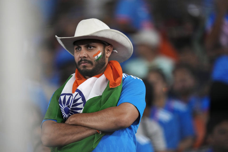 An Indian fan looks dejected during the ICC Men's Cricket World Cup final match between Australia and India in Ahmedabad, India, Sunday, Nov. 19, 2023. (AP Photo/Rafiq Maqbool)