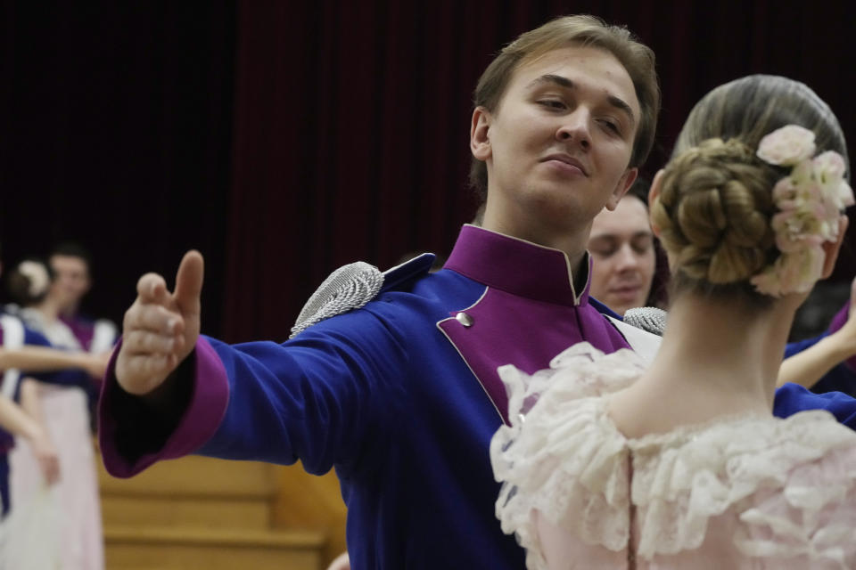 Dancers of the WARSZAWIANKA ensemble of the University of Warsaw dance Poland's national polonaise dance in 18th century costumes during dress rehearsal in Warsaw, Poland, on Feb. 8, 2024. Once banned by rulers dispatched from Moscow, Poland's stately polonaise dance that nurtured the country's spirit even through the dark years of its partition is now honored by the United Nations' education and culture agency, UNESCO. (AP Photo/Czarek Sokolowski)