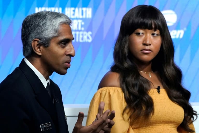 Naomi Osaka (R) took part in a mental health forum at the US Open (TIMOTHY A. CLARY)