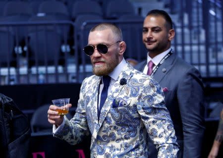UFC lightweight champion Conor McGregor of Ireland arrives for a post-fight news conference at T-Mobile Arena in Las Vegas, Nevada, U.S. August 26, 2017. REUTERS/Steve Marcus