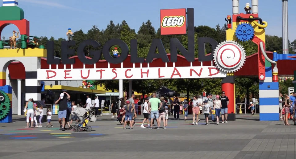 A video grab shows visitors at the Legoland theme park in Guenzburg, southern Germany on August 11, 2022.