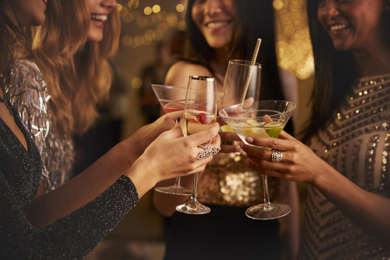 Female Friends Make Toast As They Celebrate At Party