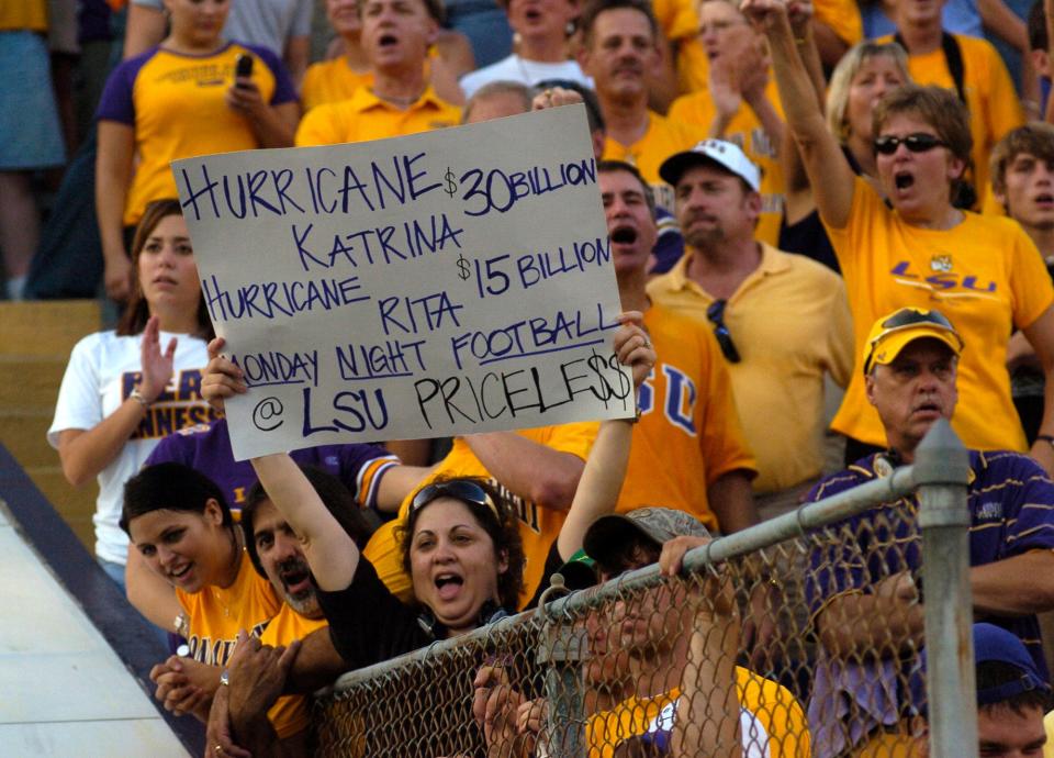 A Louisiana State fan holds a sign as the crowd cheers before LSU takes the field to play Tennesee in Baton Rouge, La. on Monday, Sept. 26, 2005. (AP Photo/Paul Rutherford)