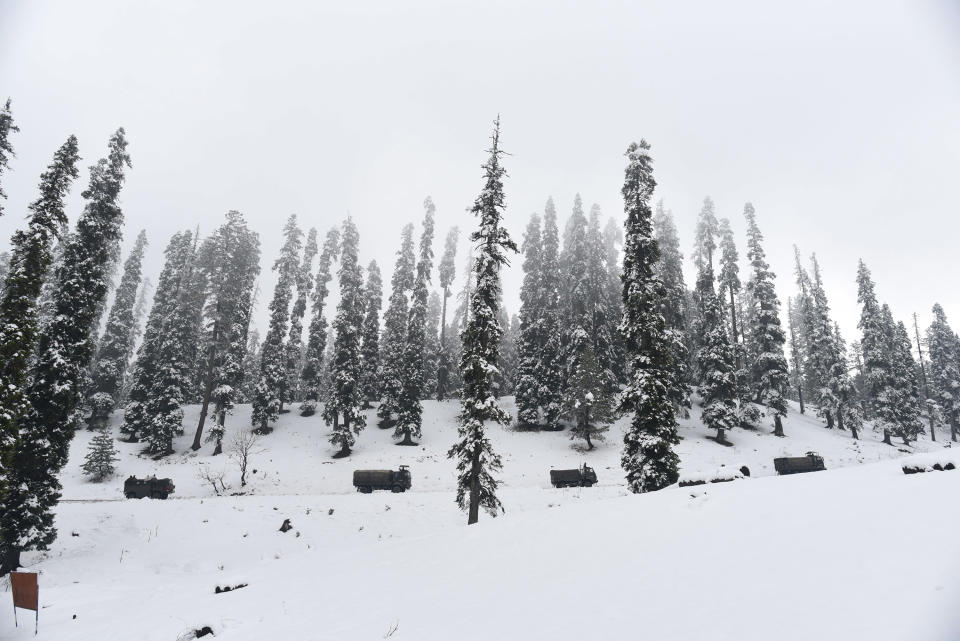 SRINAGAR, INDIA - NOVEMBER 16: Army vehicles make their way across a snow lined Gulmarg road after the seasons first snowfall in the region on November 16, 2020 in Srinagar, India. (Photo by Waseem Andrabi/Hindustan Times via Getty Images)