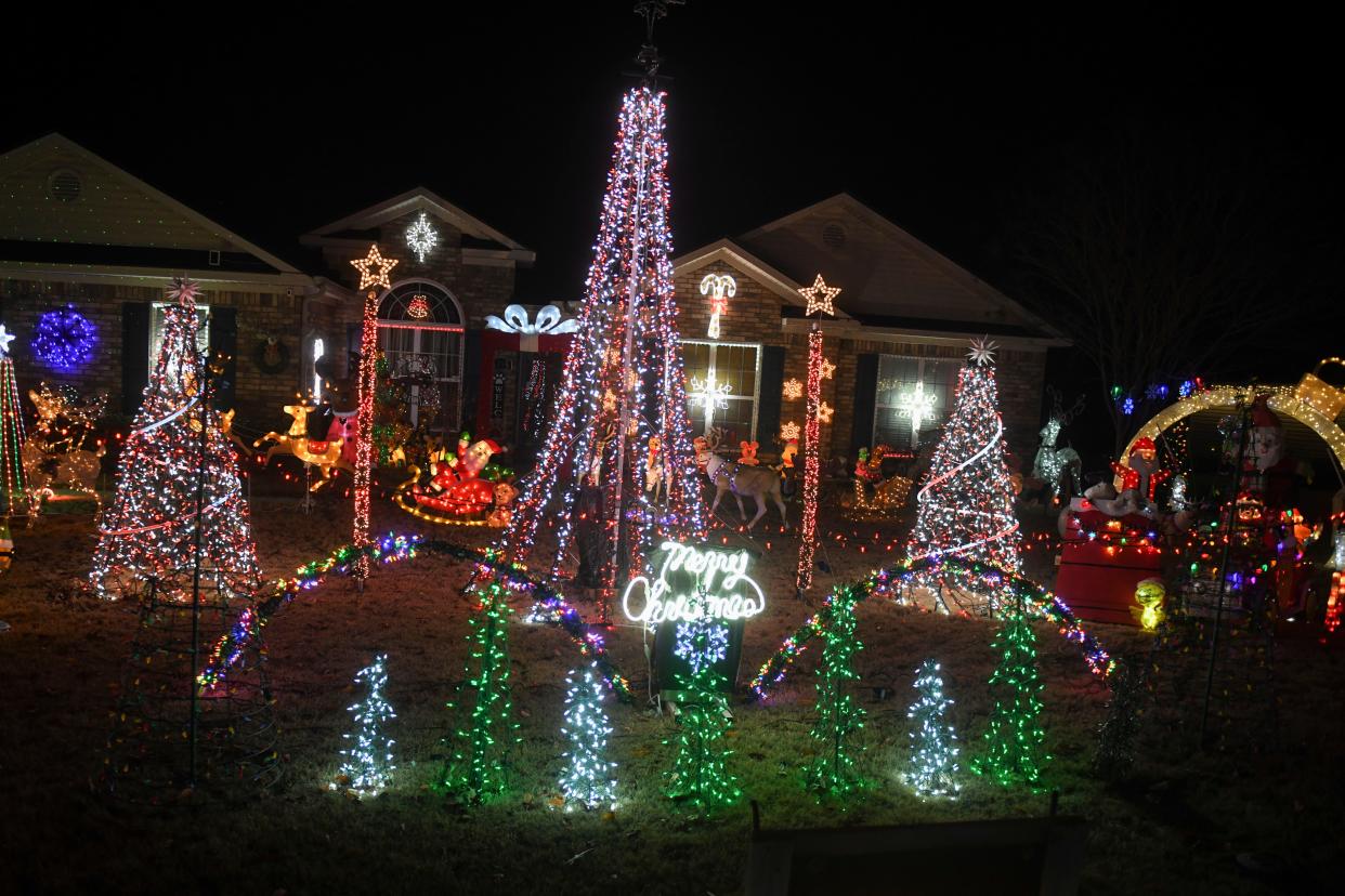 Christmas lights stand in the yard at the Hill residence on Pine Log Road on Monday, Dec. 11, 2023.