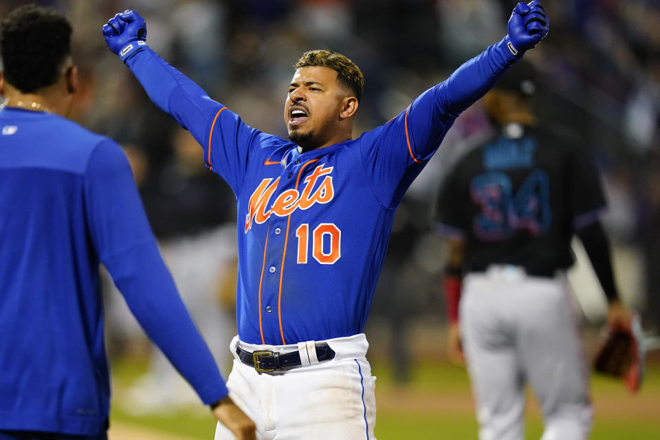 New York Mets' Eduardo Escobar (10) celebrates after hitting a walk-off RBI single during the 10th inning of a baseball game against the Miami Marlins Wednesday, Sept. 28, 2022, in New York. The Mets won 5-4. (AP Photo/Frank Franklin II)