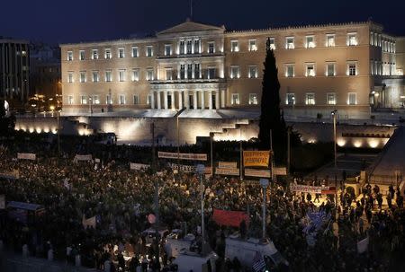 People gather for an anti-austerity, pro-government demonstration outside the Greek parliament in Athens on the eve of a crucial euro zone finance minister's meeting to discuss the country's future, February 11, 2015. REUTERS/Alkis Konstantinidis