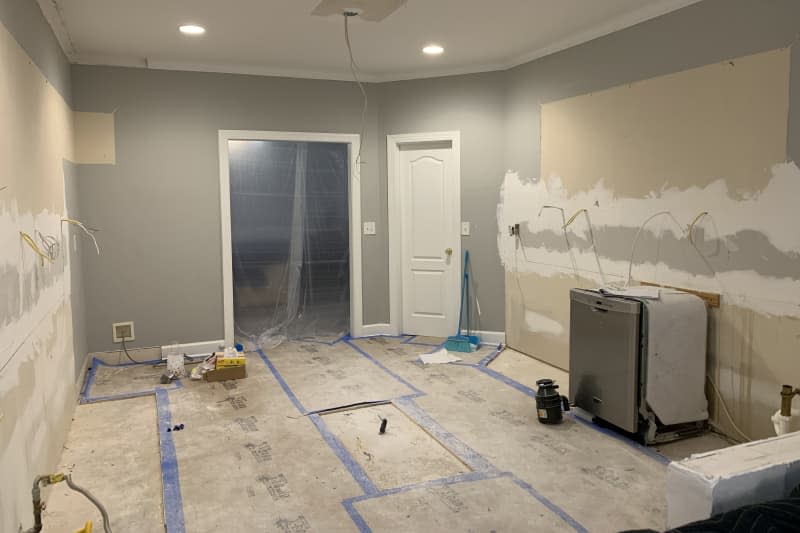 Grey empty kitchen under renovation