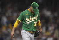 Oakland Athletics starting pitcher James Kaprielian walks off the field after being removed during the fifth inning of the team's baseball game against the San Diego Padres, Tuesday, July 27, 2021, in San Diego. (AP Photo/Derrick Tuskan)