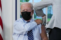 President Joe Biden receives a COVID-19 booster shot during an event in the South Court Auditorium on the White House campus, Monday, Sept. 27, 2021, in Washington. (AP Photo/Evan Vucci)