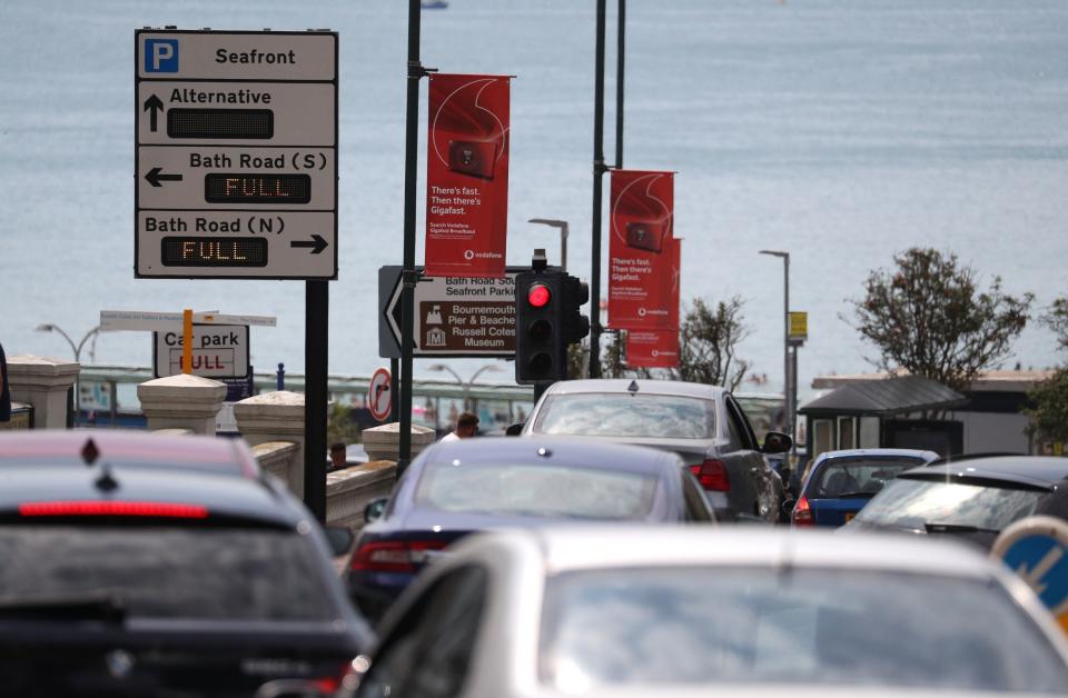 Cars queue up as they head down towards the sea front at Bournemouth beach (PA)