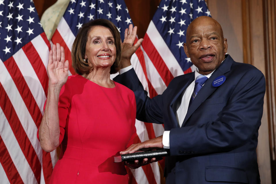 House Speaker Nancy Pelosi of Calif., left, poses during a ceremonial swearing-in with Rep. John Lewis, D-Ga., right, on Capitol Hill on Jan. 3, 2019 in Washington  during the opening session of the 116th Congress.. (Photo: Alex Brandon/AP)