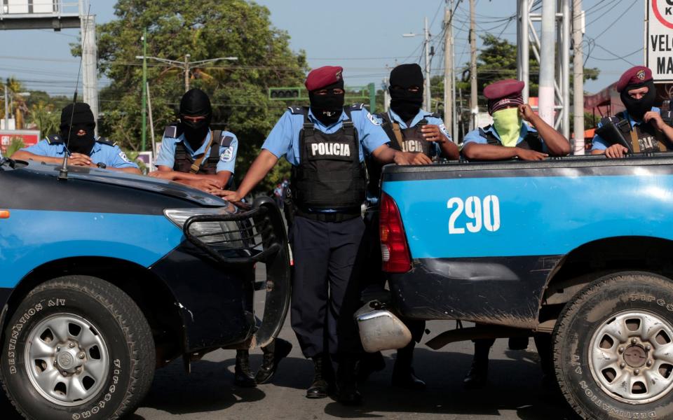 Police block the entrance of Divine Mercy Catholic Church in Managua as protests continue - REUTERS