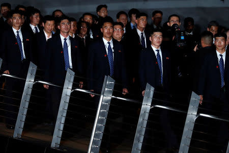 North Korea's leader Kim Jong Un is surrounded by guards as he visits Merlion Park in Singapore, June 11, 2018. REUTERS/Tyrone Siu