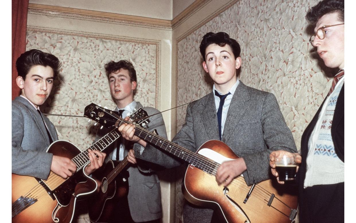 The earliest colour photograph of The Beatles, showing Paul McCartney, John Lennon and George Harrison, along with Dennis Littler, a friend - Mike McCartney
