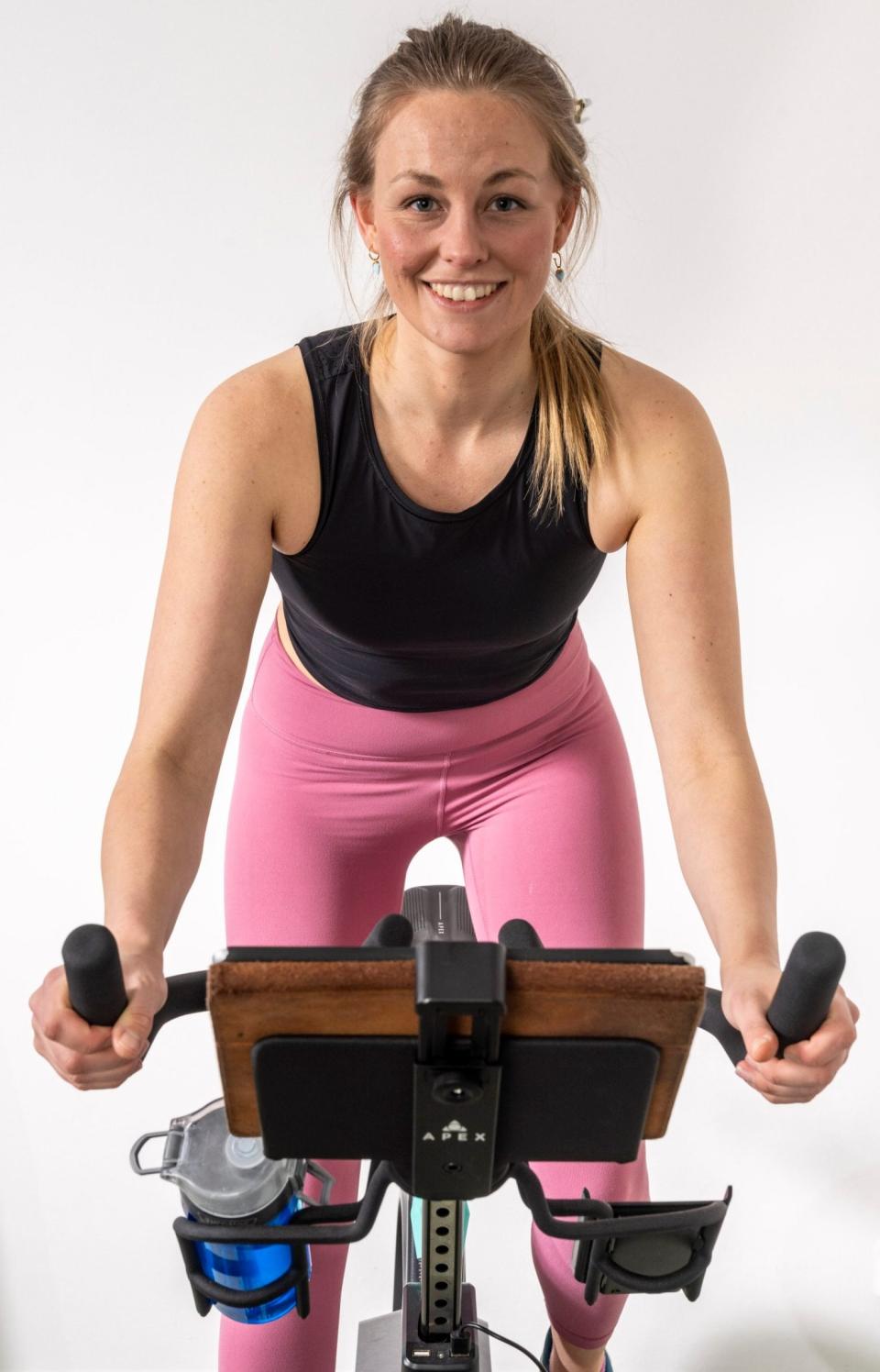 Maddi Howell on her Apex exercise bike - Andrew Crowley/The Telegraph