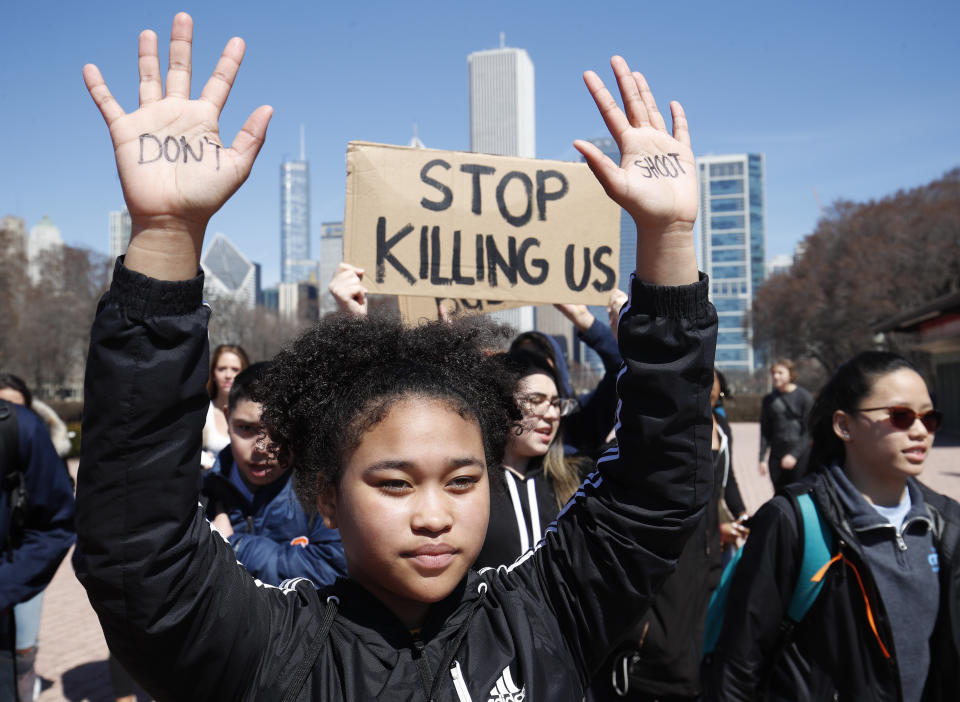 A student holds up her hands while taking part in National School Walkout Day to protest school violence on April 20, 2018 in Chicago, Illinois.&nbsp;