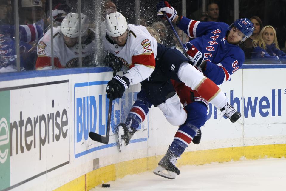 Florida Panthers forward Dmitry Kulikov (7) and New York Rangers forward Will Cuylle (50) collide during the second period of Game 1.