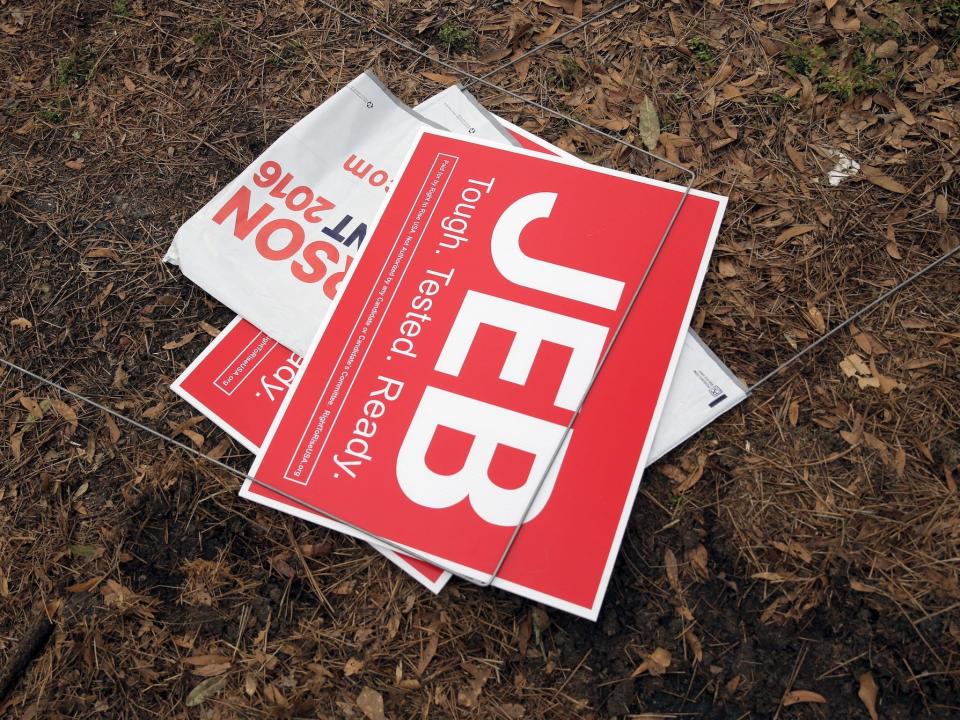 Lawn signs for Jeb Bush and Ben Carson on the ground in South Carolina during the 2016 presidential primaries.